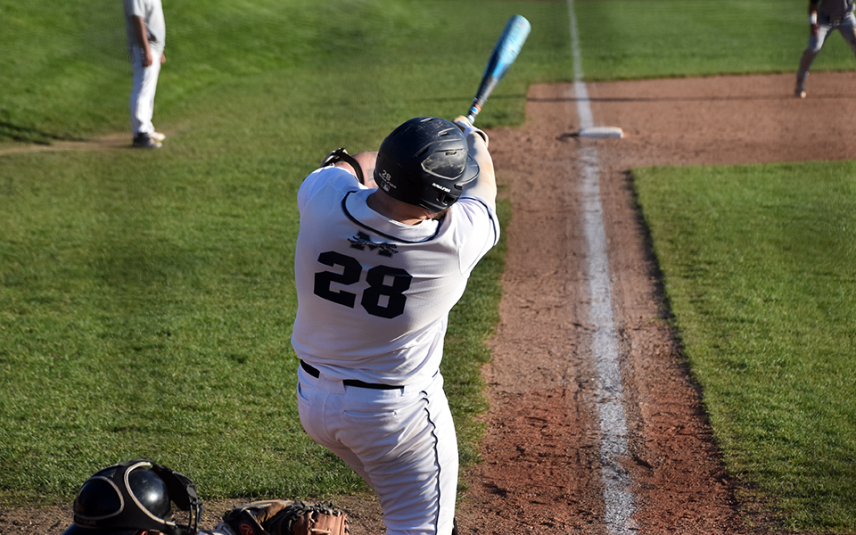 Graduate student third baseman Paul Hamilton swings during the Greyhounds' series finale with Drew University at Gillespie Field. Photo by Abby Smith '27
