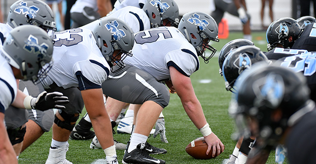 The Greyhounds offensive line is ready for the snap at No. 14 Johns Hopkins University.