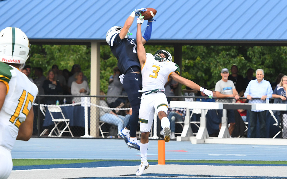 Junior wide receiver Nick Petros grabs a touchdown pass early in the third quarter versus McDaniel College at Rocco Calvo Field.