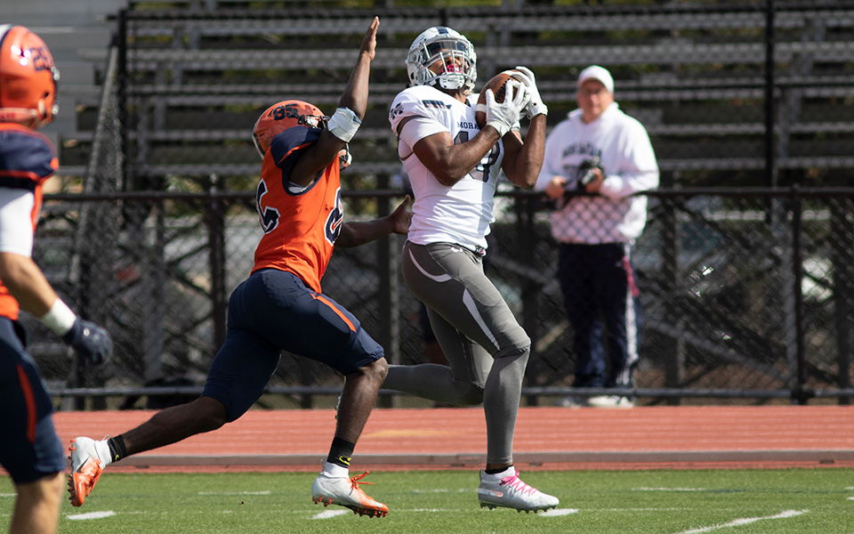 Senior wide receiver Alex Pierce pulls in a 36-yard reception to set up a touchdown just before halftime at Gettysburg College. Photo by Andy Grosh