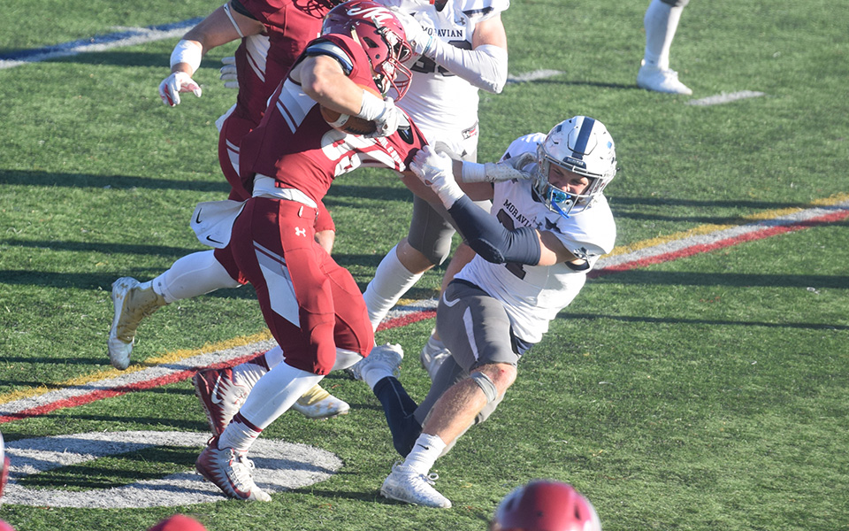 Junior Jackson Buskirk makes a tackle during the second half at Muhlenberg College.