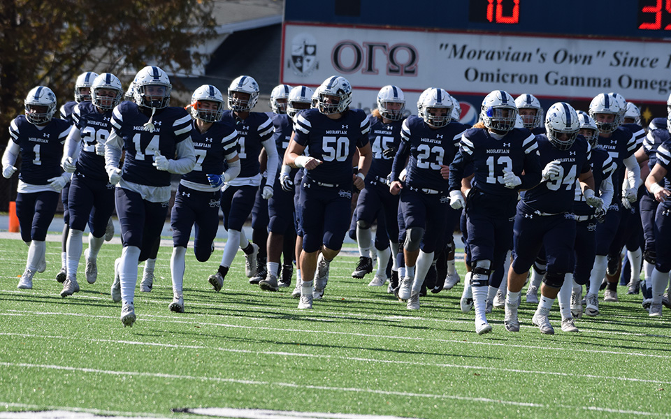 The Greyhounds head onto the field before kickoff versus Muhlenberg College to wrap up the 2019 season on Rocco Calvo Field.