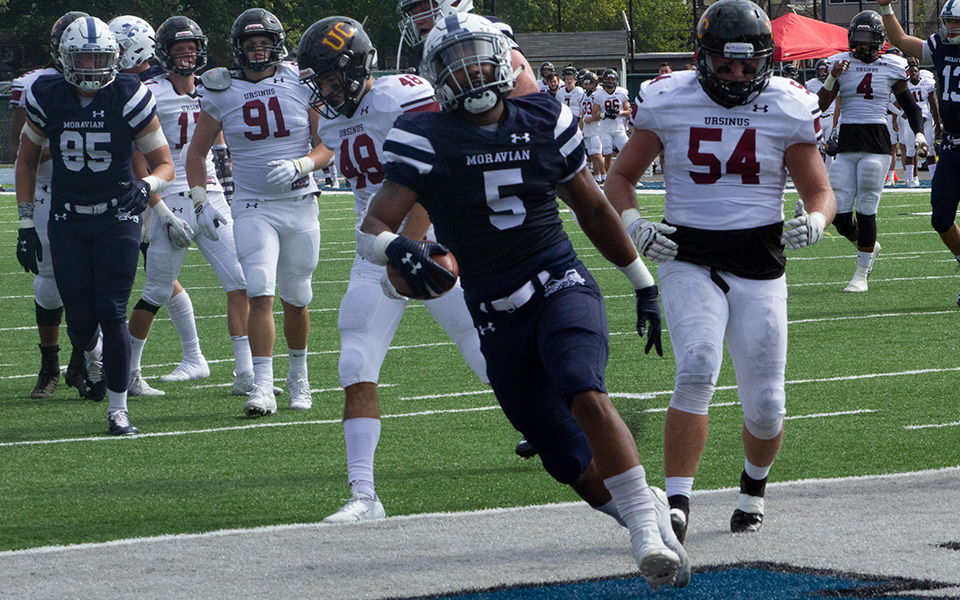 Roberto Diez gets into the end zone with the first of three touchdowns versus Ursinus College at Rocco Calvo Field.