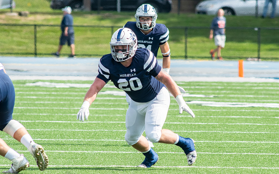 Brady Hornbaker and Jackson Buskirk at the snap on defense during the 2018 season versus Gettysburg College at Rocco Calvo Field.