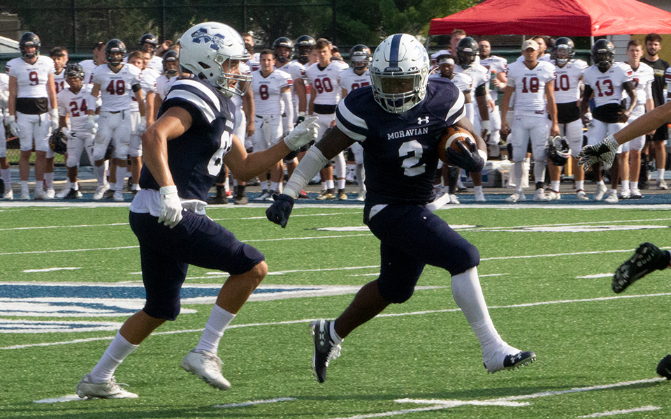 Sophomore wide receiver Cory Little cuts back during an 87-yard kickoff return versus Ursinus College at Rocco Calvo Field.