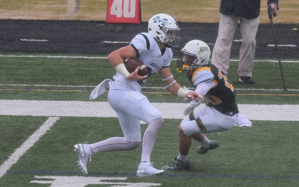Jackson Buskirk returns a punt during a rainy game at McDaniel College during the 2018 season won by the Greyhounds, 14-9.