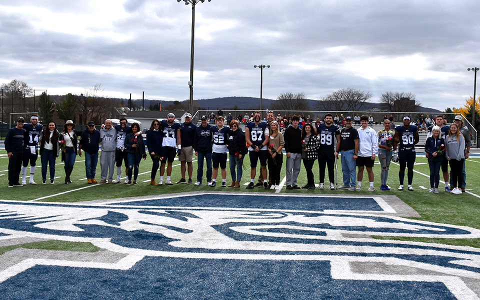 The 2022 Moravian football seniors and their families on Senior Day at Rocco Calvo Field. Photo by Ava Edwards '22