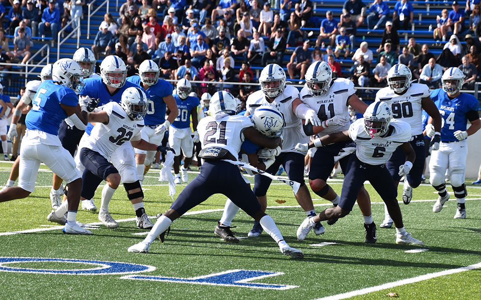 The Greyhounds' defense swarms to the ball in the first half of action at Franklin & Marshall College.