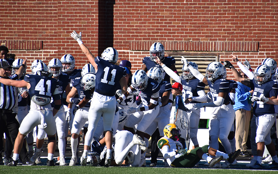 The Greyhounds celebrate an interception by freshman defensive back Matt Capobianco in the second half against McDaniel College at Rocco Calvo Field. Photo by Ava Edwards '22