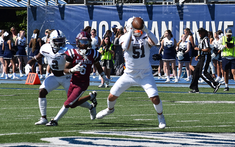 Sophomore linebacker Ethan O'Neill makes an interception versus The Apprentice School at Rocco Calvo Field on Gary Martell Day. Photo by Walker McCrary, Apprentice School Sports Information Director