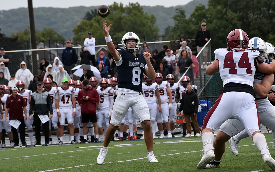 Senior quarterback throws his first touchdown pass of the 2024 season during the first half versus No. 21 Muhlenberg College at Rooco Calvo Field. Photo by Gilliam Slowinski '27