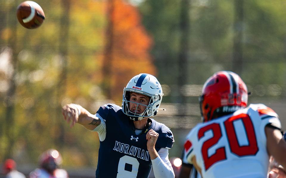 Senior quarterback Jared Jenkins throws a pass versus The Catholic University of America at Rocco Calvo Field. Photo by Brandon Santiago '25