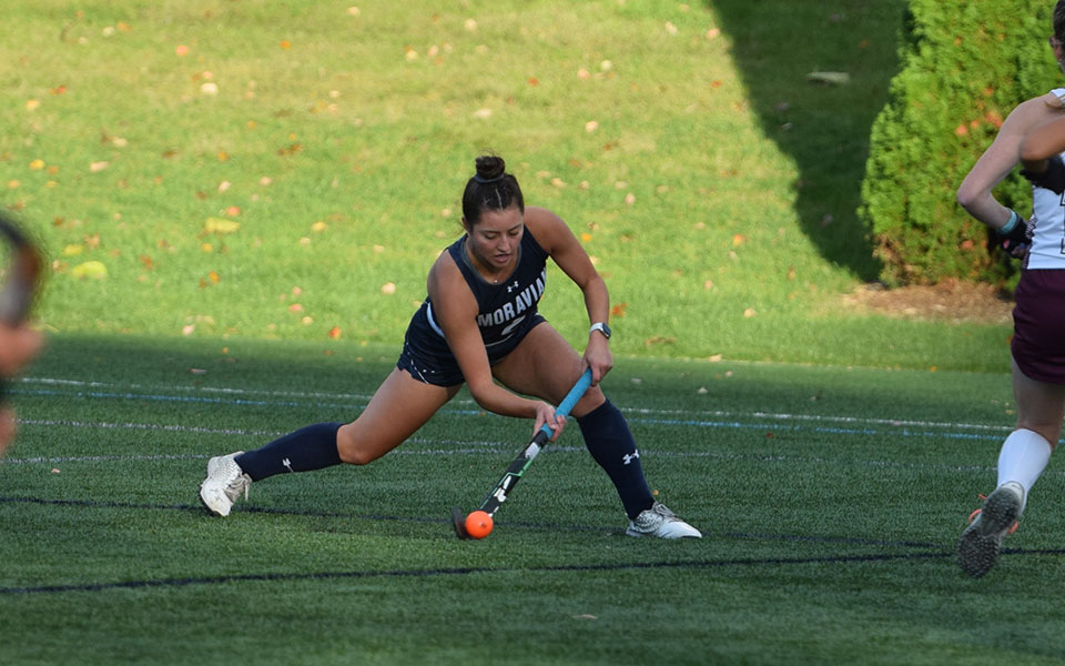Sophomore Sarah Bietka plays a ball towards the circle in the first half of a non-conference match versus Ramapo College of New Jersey on John Makuvek Field.