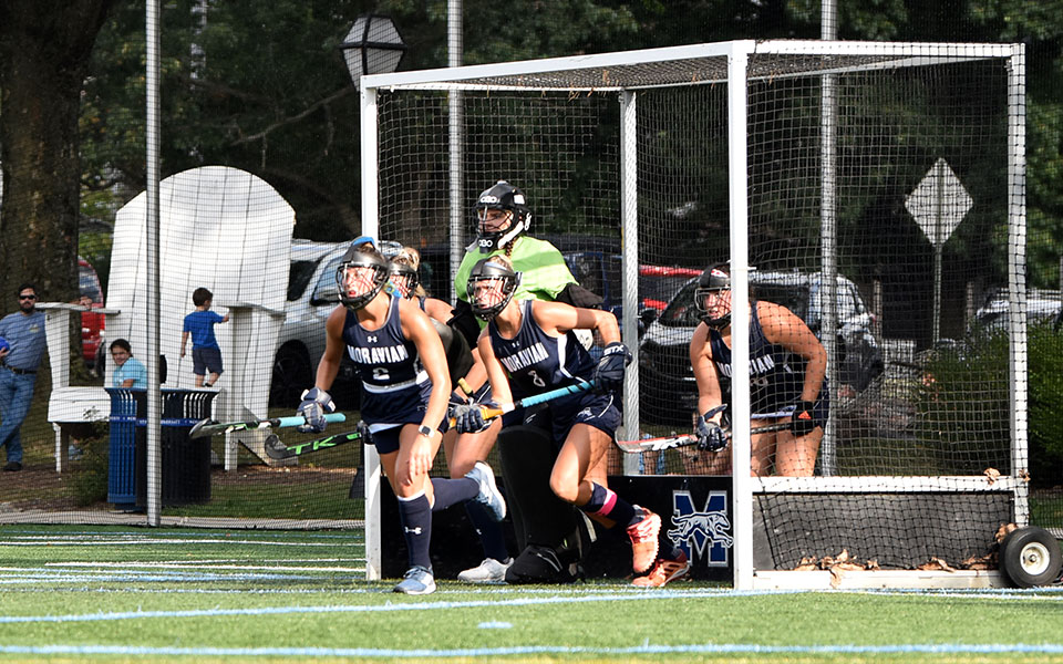 The Greyhounds' defense sprinted out of the goal on a penalty corner on John Makuvek Field. (Photo by Avery Saladino '24)