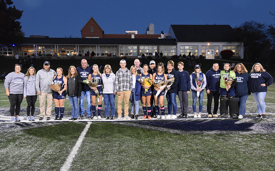 Moravian's 2022 senior field hockey players and their parents on Senior Day before the Greyhounds' match with Goucher College. Photo by Jordyn Itterly '25
