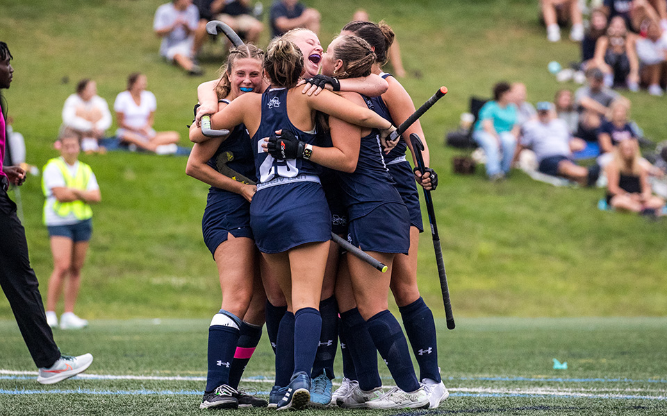 The Hounds celebrate the first career goal for senior Lexi Dinsmore on John Makuvek Field versus DeSales University to begin the 2024 season. Photo by Cosmic Fox Media / Matthew Levine '11