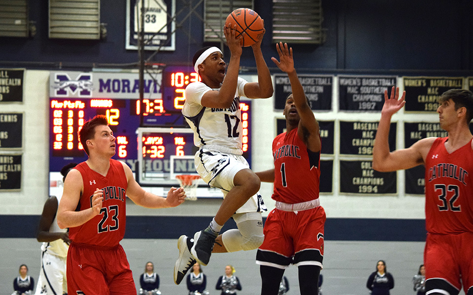Junior Elijah Davis goes up for a lay-up in the first half versus The Catholic University of America in Johnston Hall.
