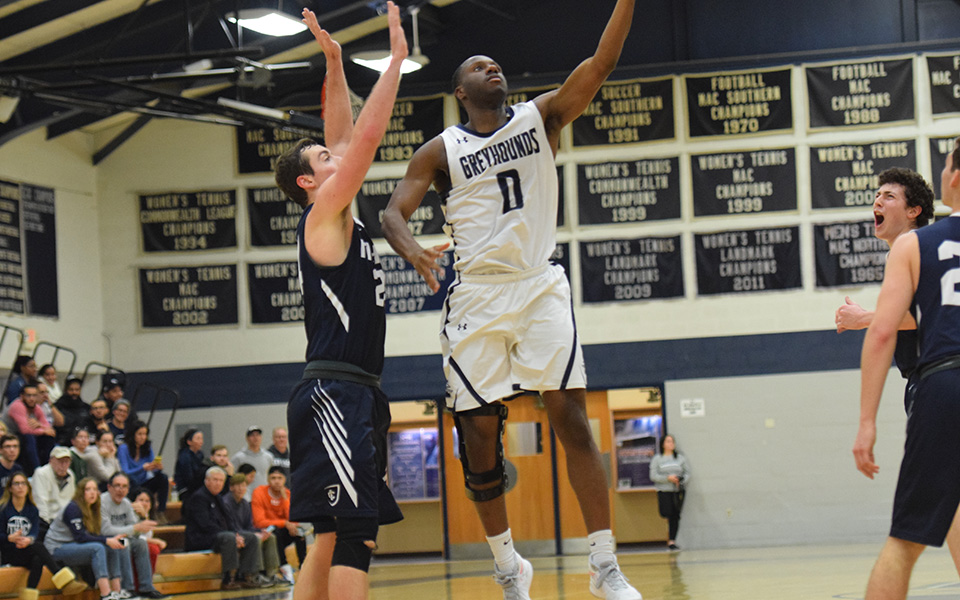 Senior forward John Hargraves goes up for a lay-up versus Ithaca College in Johnston Hall during the 40th Steel Club Classic.