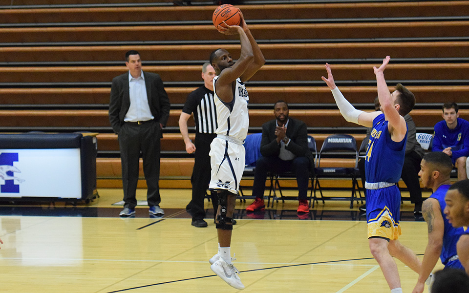 Senior John Hargraves takes a jumper during the first half versus Goucher College in Johnston Hall.