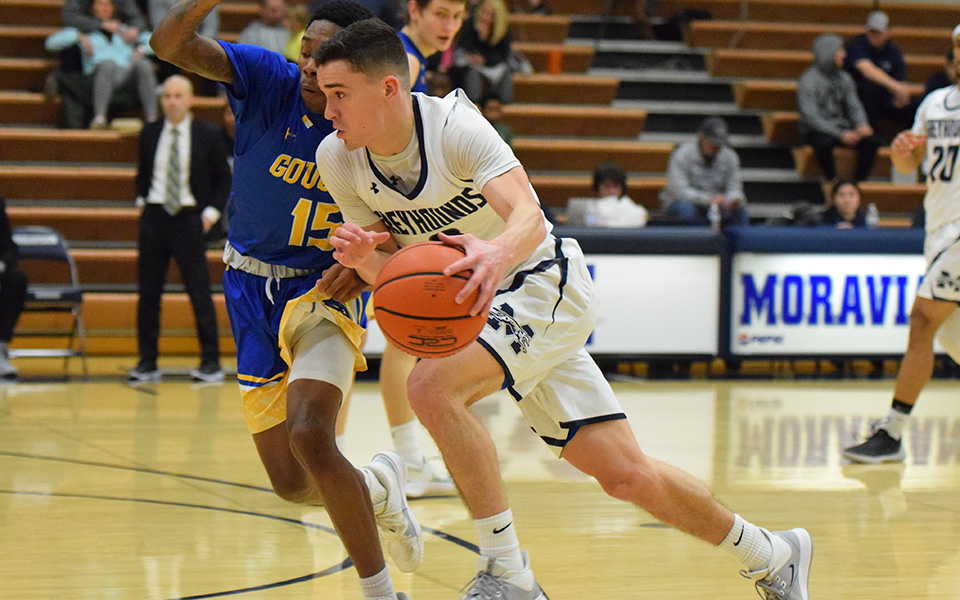 Junior guard Matt O'Connor drives towards the basket in the second half of a game versus Goucher College in Johnston Hall.
