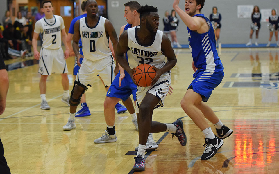 Senior forward Addis Ralph makes a move to the basket during the first half of a game versus Elizabethtown College in Johnston Hall.
