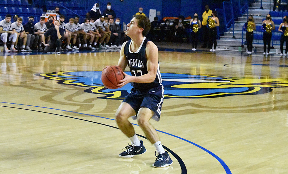 Sophomore Alex Dietz attempting a jump shot in an exhibition game against Division I opponent, the University of Delaware.