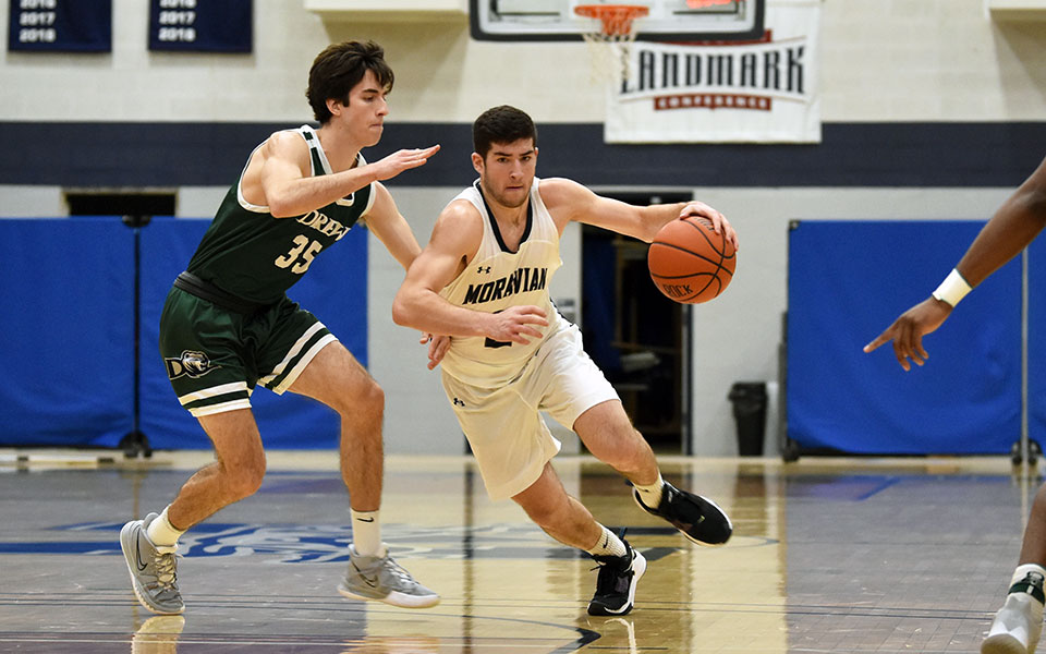 Senior guard Danny Cooper makes a move to the basket in the second half of a game versus Drew University in Johnston Hall in January 2021. Photo by Mairi West '23