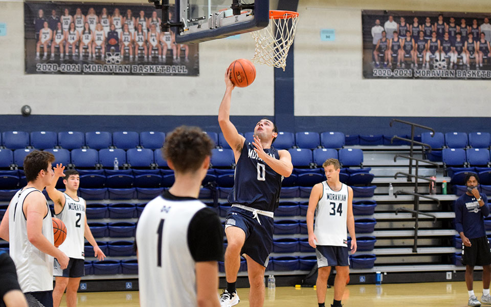 Junior forward Joe Paulillo goes up for a lay-up in practice in Johnston Hall as the Greyhounds get set for the 2021-22 season.