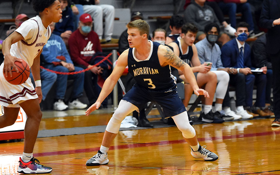 Sophomore guard C.J. Weber on defense during the first half of a game at Muhlenberg College to begin the 2021-22 season.