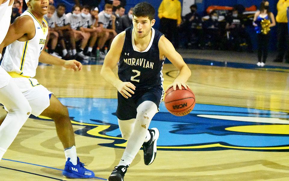 Senior Danny Cooper brings the ball up the floor in the Bob Carpenter Center at the University of Delaware as the Greyhounds took on the Blue Hens in an exhibition game.