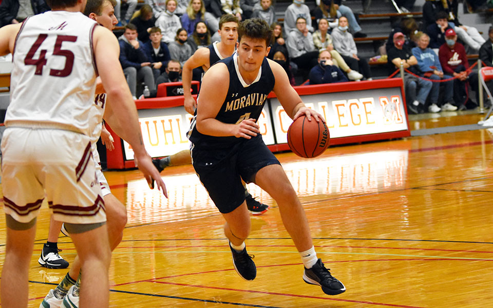 Sophomore Mike DiPietro drives to the basket in the first half of the 2021-22 season opener at Muhlenberg College.