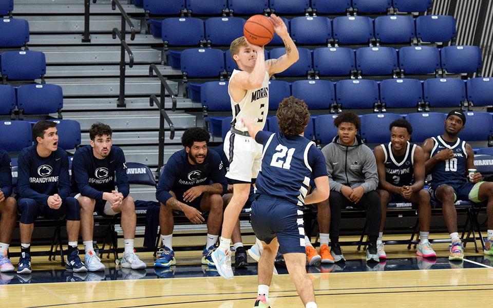 Junior guard C.J. Weber shoots a three-pointer in the first half versus Penn State Brandywine in Johnston Hall. Photo by Jordyn Itterly '25