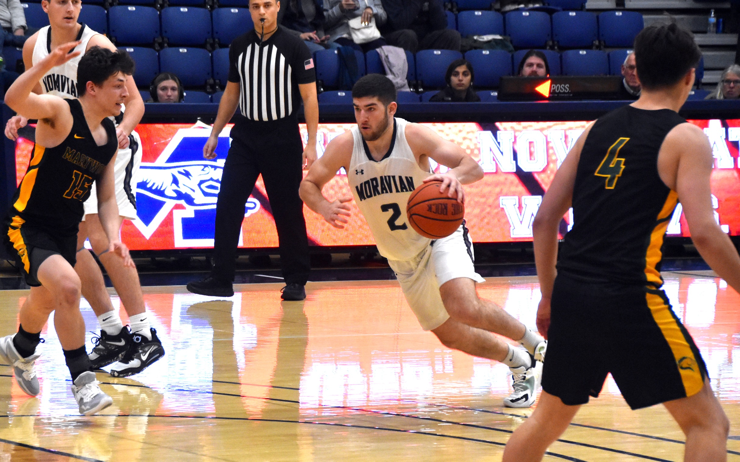 Graduate student guard Danny Cooper drives towards the basket in the second half versus Marywood University in Johnston Hall. Photo by Avery Saladino '24