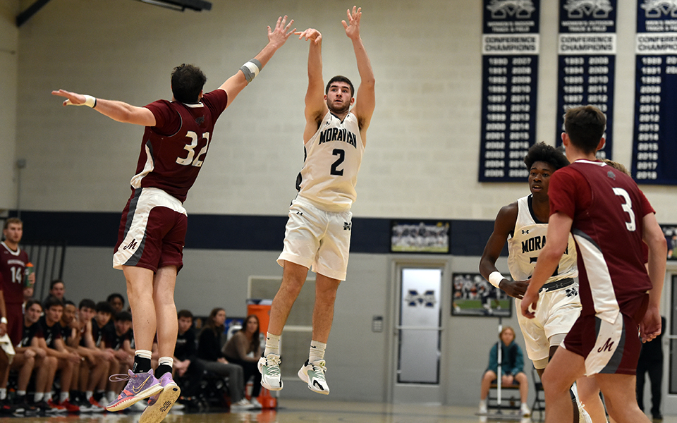 Graduate student guard Danny Cooper shoots a three-pointer in the second half versus Muhlenberg College in Johnston Hall. Photo by Mairi West '23
