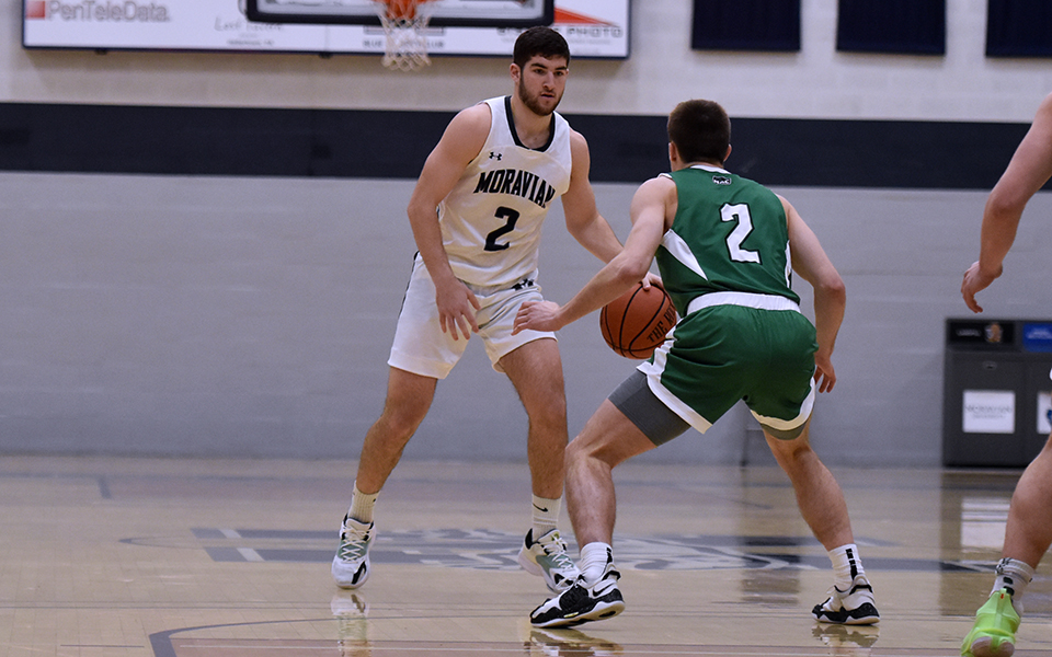 Graduate student guard Danny Cooper runs the offense during the first half of the 42nd Steel Club Classic Championship game versus York College of Pennsylvania in Johnston Hall. Photo by Mairi West '23