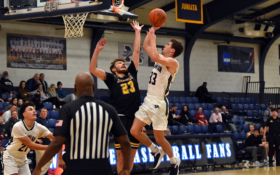Senior guard Alex Dietz goes up for a lay-up in the second half versus Alvernia University in the championship game of the 43rd Steel Club Classic in Johnston Hall. Photo by Jordyn Itterly '25