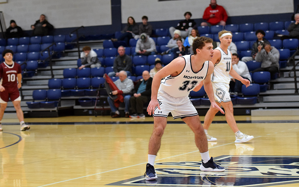 Graduate student Alex Dietz and junior guard Porter Kelly on defense in the second half versus Muhlenberg College in Johnston Hall.