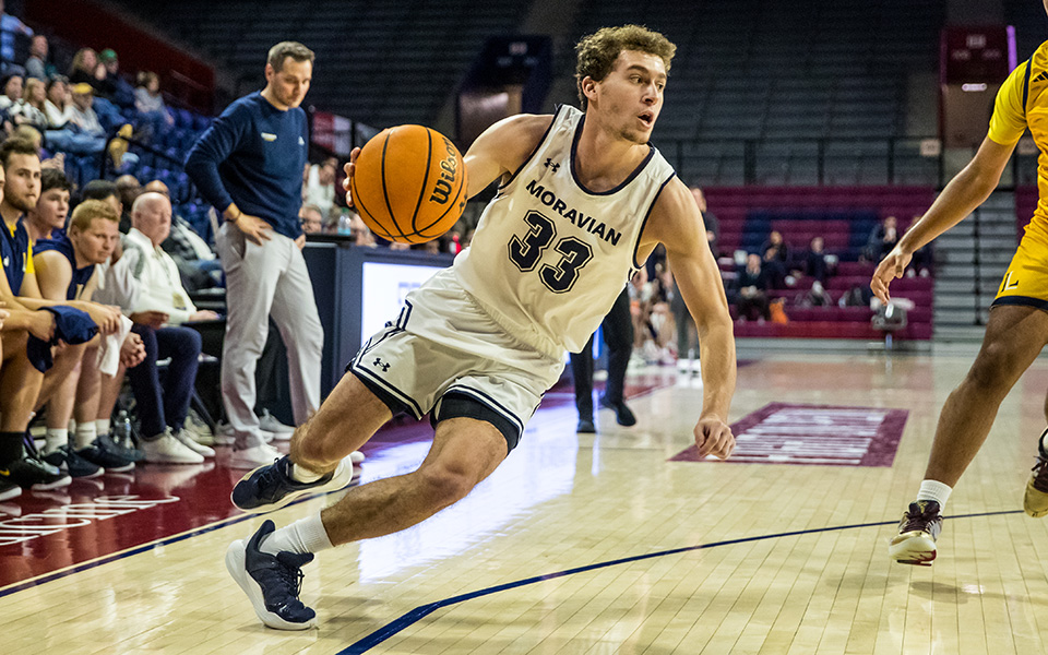 Graduate student guard Alex Dietz drives the to the corner in the first half versus Lycoming College at The Palestra. Photo by Cosmic Fox Media / Matthew Levine '11