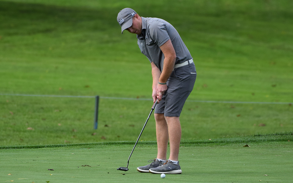 Nick Kuhn taps in a putt on the first hole of the 2018 Moravian Weyhill Classic at Saucon Valley Country Club.