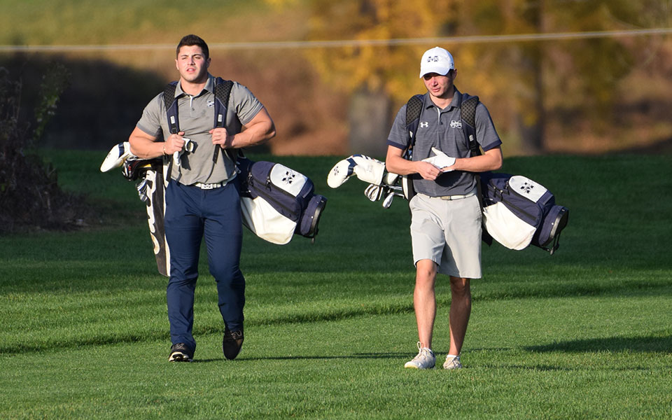 Seniors Victor Tavares and Kody Kolnik walk towards the fifth green on the Weyhill Course at Saucon Valley Country Club during the Blue & Grey Scrimmage in October 2020.