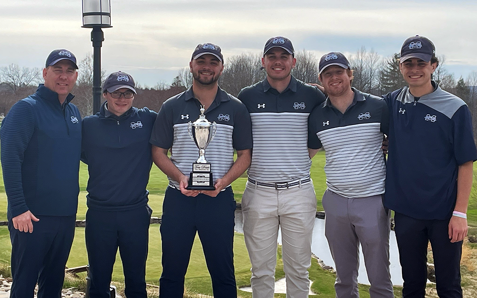The Greyhounds pose with the winner's trophy at the Glenmaura National Collegiate Invitational.