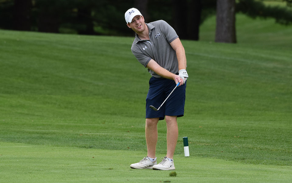 Graduate student Nick Kuhn '20 watches a chip during the Moravian Weyhill Classic in October 2019.