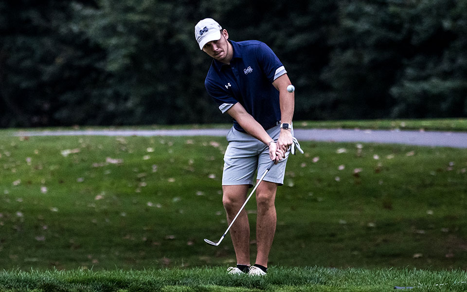 Senior Will Breslin chips a shot during the John Makuvek Cup at the Lehigh Country Club. Photo by Cosmic Fox Media / Matthew Levine '11.
