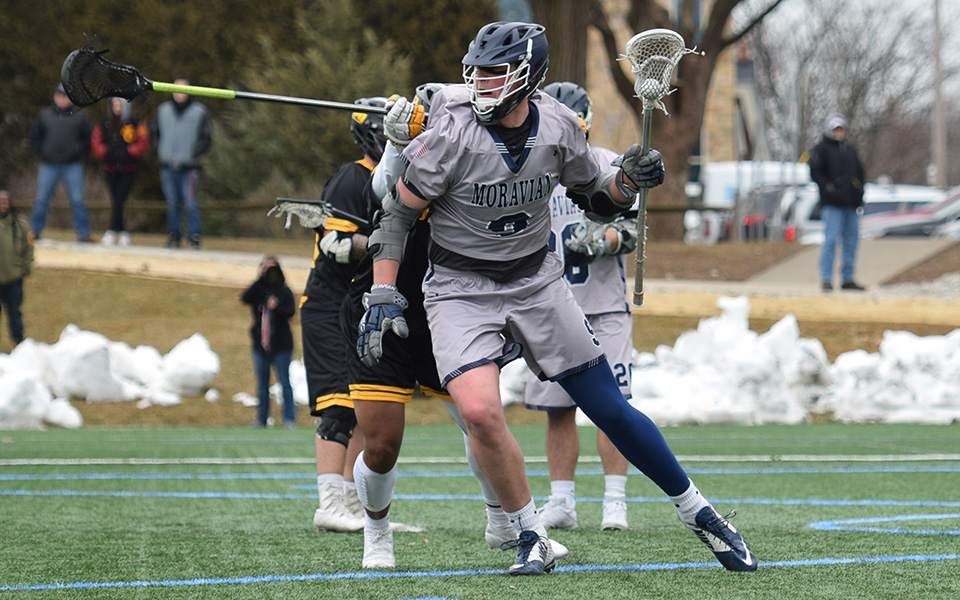 Junior Cade Siddron cuts from behind the net in the 2019 home opener versus Delaware Valley University.