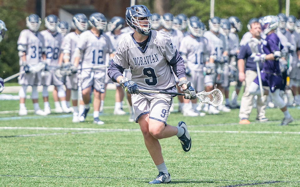 Senior attack Cade Siddron moves down the field in a match on John Makuvek Field during the 2019 season.