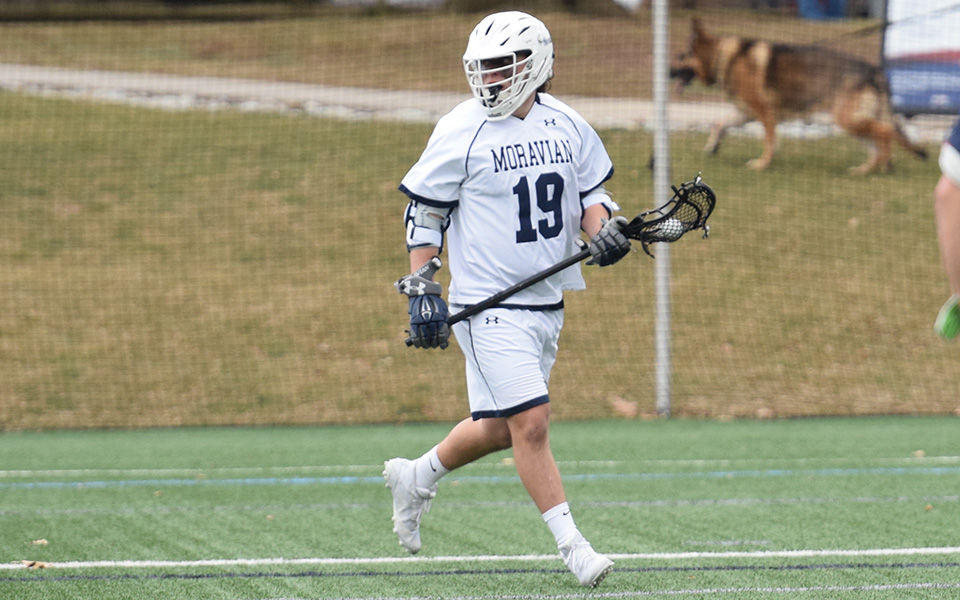 Junior attack Connor Hull looks to pass during the first quarter versus DeSales University on John Makuvek Field as the Greyhounds debuted their new home uniforms.