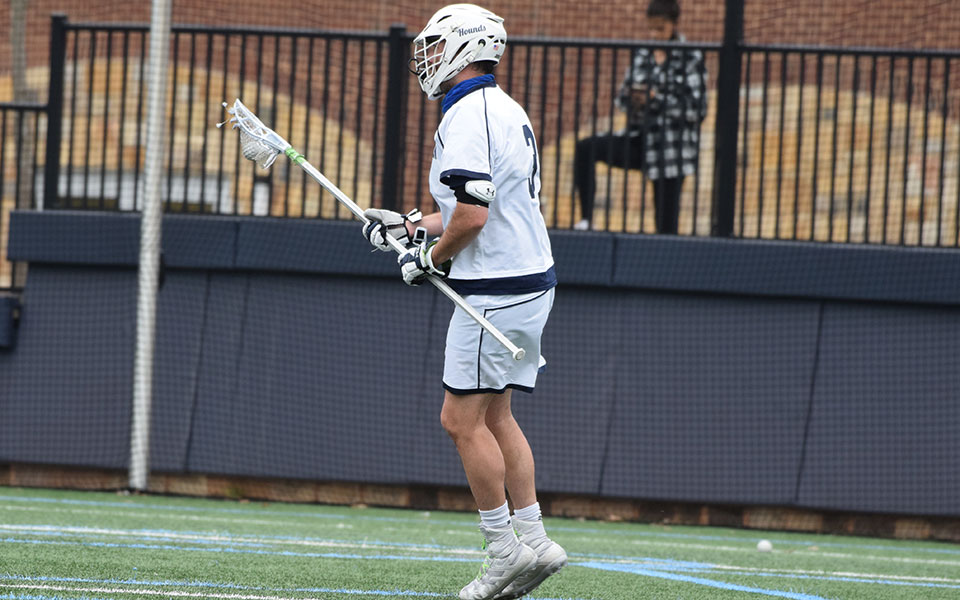 Jimmy Schicke '21 looks to pass after scooping up a ground ball versus Elizabethtown College at John Makuvek Field on April 14.