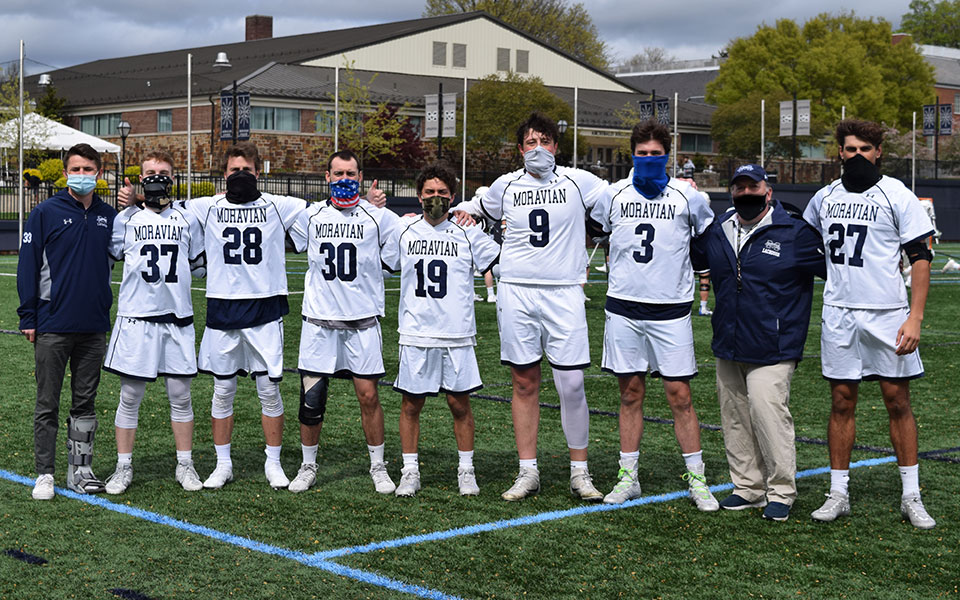 Connor Sablich, Timothy Dwyer, Max Towers, Trevor Green, Connor Hull, Cade Siddron, Jimmy Schicke, Head Coach Dave Carty and Tanner Leslie after the Greyhounds' Senior Day presentation prior to Moravian's match with The Catholic University of America on John Makuvek Field.