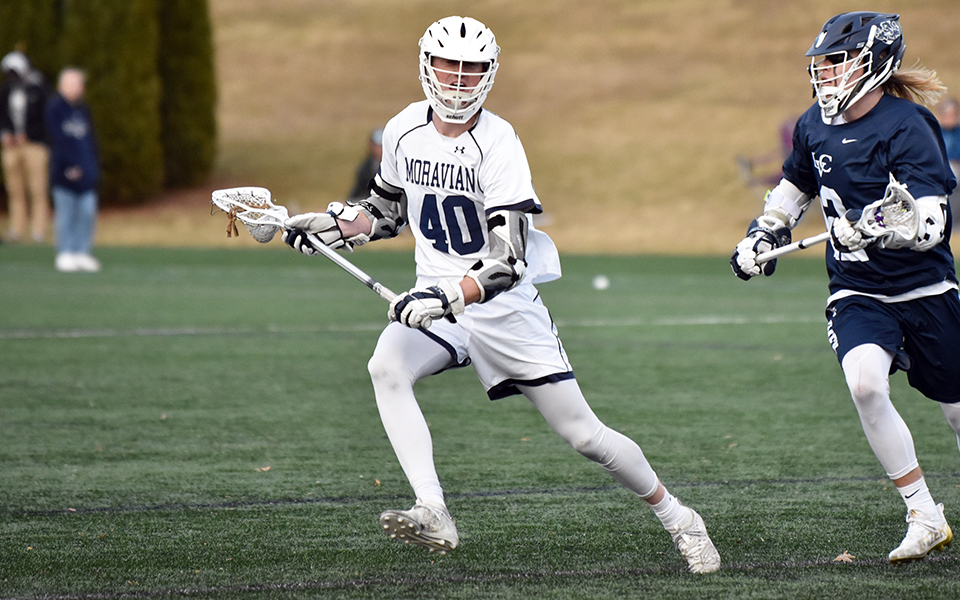 Senior midfielder Nick Nolder looks to make a move towards the net in a match versus Lebanon Valley College on John Makuvek Field in February 2022. Photo by Marissa Werner '23