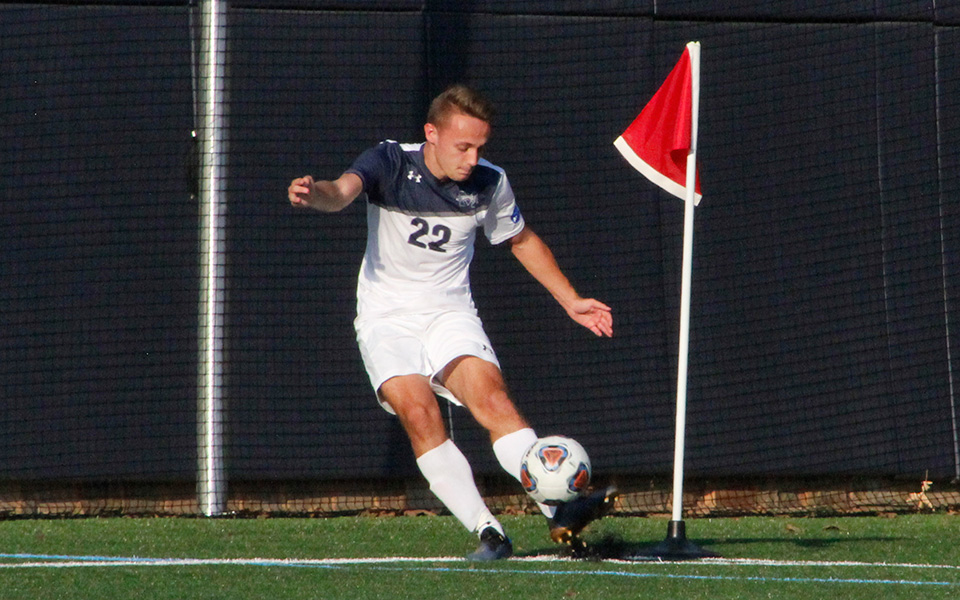 Junior Ethan Blakely takes a corner kick in a match versus Lycoming College on John Makuvek Field.